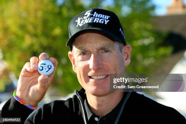 Jim Furyk holds up his ball with a '59' on it after shooting a 59 during the Second Round of the BMW Championship at Conway Farms Golf Club on...