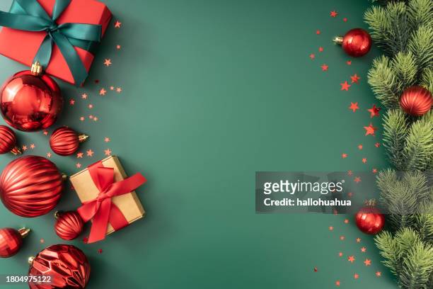 green christmas background with fir branches and decorations. - christmas decorations stockfoto's en -beelden