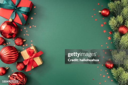 Green Christmas background with fir branches and decorations.