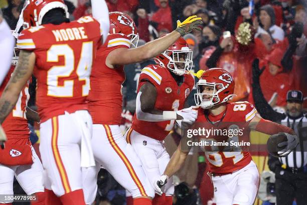 Justin Watson of the Kansas City Chiefs is congratulated by teammates after he scored a touchdown against the Philadelphia Eagles in the first half...