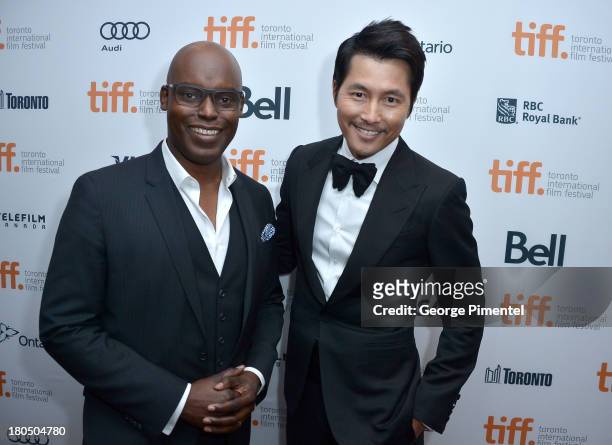 Co-Director Cameron Bailey and actor Woo-sung Jung attend the "Cold Eyes" premiere during the 2013 Toronto International Film Festival at Roy Thomson...