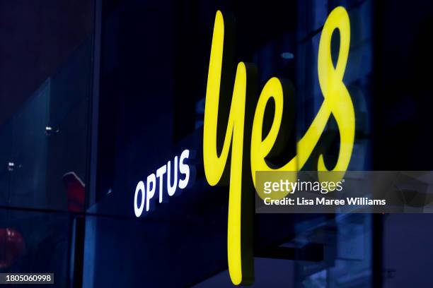 The Optus company sign and logo are displayed in a store window in the CBD on November 21, 2023 in Sydney, Australia. Optus' CEO Kelly Bayer Rosmarin...