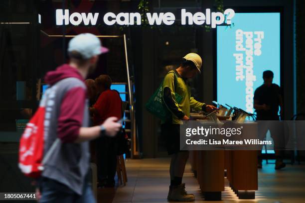 Customers visit an Optus store in the CBD on November 21, 2023 in Sydney, Australia. Optus' CEO Kelly Bayer Rosmarin stepped down on Monday after an...