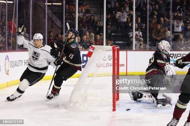 Trevor Moore of the Los Angeles Kings celebrates after scoring a short-handed goal past Alexander Kerfoot and goaltender Connor Ingram of the Arizona...