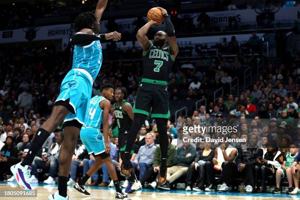 Mark Williams of the Charlotte Hornets defends a shot by Jaylen Brown of the Boston Celtics during the second half of an NBA game at Spectrum Center...