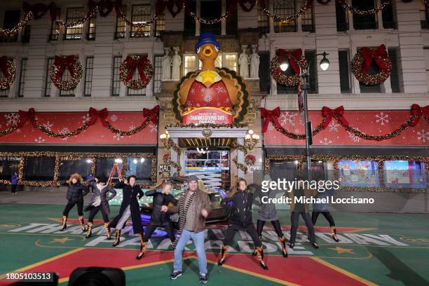 Roger Bart and cast perform "Back to the Future: The Musical" during day one of 97th Macy's Thanksgiving Day Parade rehearsals at Macy's Herald...