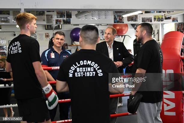 Prince Edward, Duke of Edinburgh, speaks with boxers and representatives from the Youth Boxing Program at the Police Citizens Youth Centre in...