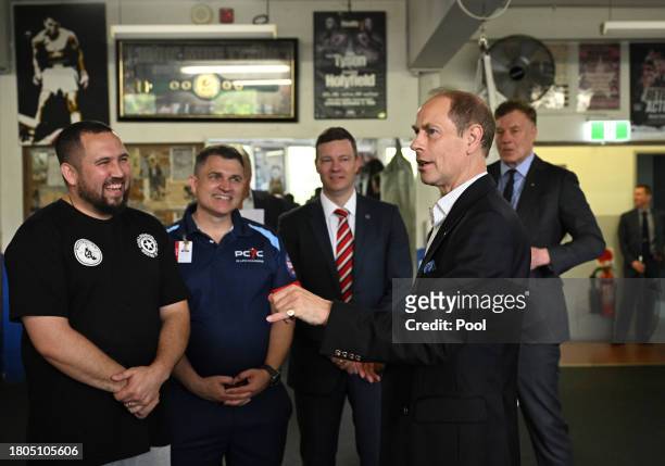 Prince Edward, Duke of Edinburgh, talks with boxers and representatives from the Youth Boxing Program at the Police Citizens Youth Centre in...