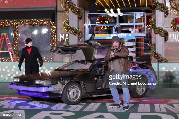 Roger Bart and Casey Likes perform "Back to the Future: The Musical" during day one of 97th Macy's Thanksgiving Day Parade rehearsals at Macy's...