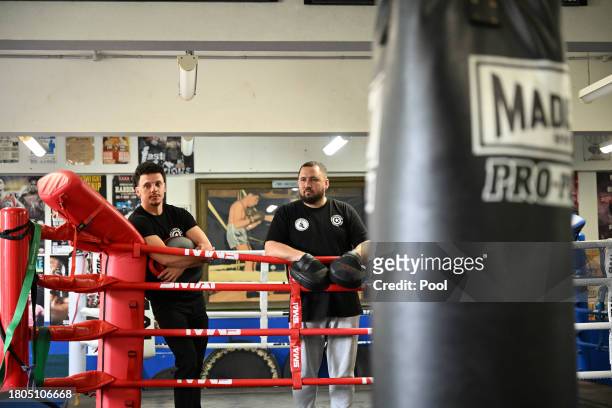 Head coach Adam Thompson looks on with club manager Tom Tefler from the Youth Boxing Program at the Police Citizens Youth Centre before meeting...