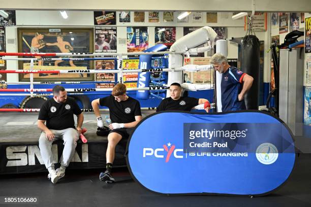 Head coach Adam Thompson with 21 year old Marlon Sevehon, 17 year old Franco Lee, and a PCYC representative from the Youth Boxing Program at the...
