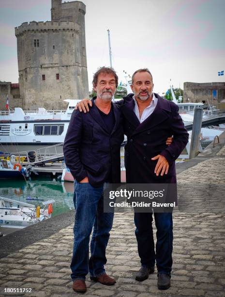 Olivier Marshal and Antoine Dulery pose during the photocall of 'Vaugand' at 15th Festival of TV Fiction on September 13, 2013 in La Rochelle, France.