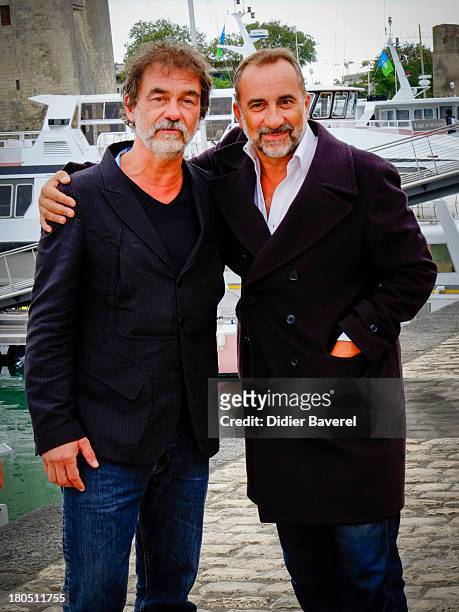Olivier Marshal and Antoine Dulery pose during the photocall of 'Vaugand' at 15th Festival of TV Fiction on September 13, 2013 in La Rochelle, France.