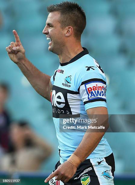 Beau Ryanof the Sharks celebrates scoring a try during the NRL Elimination Final match between the Cronulla Sharks and the North Queensland Cowboys...