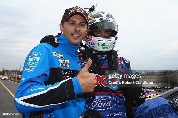 Will Davison driver of the Pepsi Max Ford celebrates with co driver Steve Owen after taking pole position for the Sandown 500, which is round 10 of...