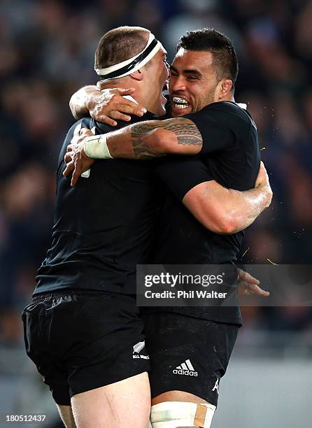 Brodie Retallick of the All Blacks is congratulated on his try by Liam Messam during The Rugby Championship match between the New Zealand All Blacks...