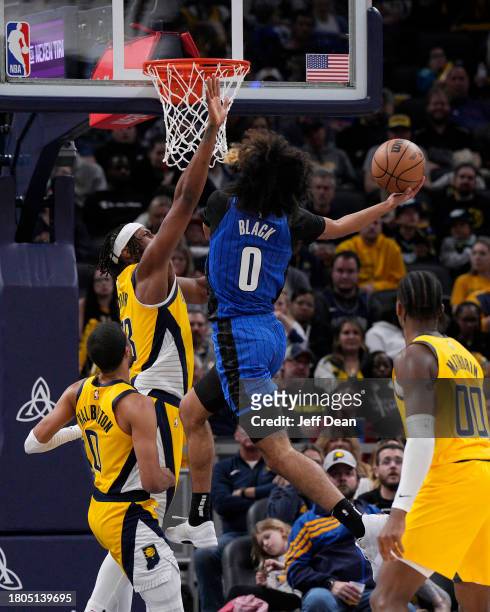 Anthony Black of the Orlando Magic shoots against Myles Turner of the Indiana Pacers at Gainbridge Fieldhouse on November 19, 2023 in Indianapolis,...