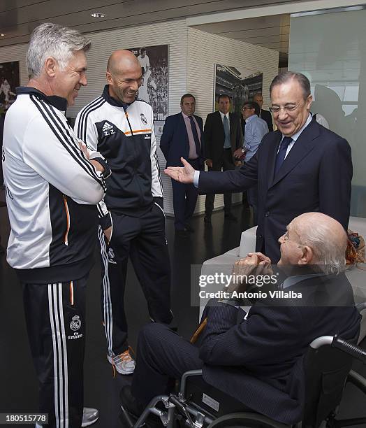 Real Madrid's President Florentino Perez talks with head coach Carlos Ancelotti , assistant Zinedine Zidane and Honorary President Alfredo di Stefano...