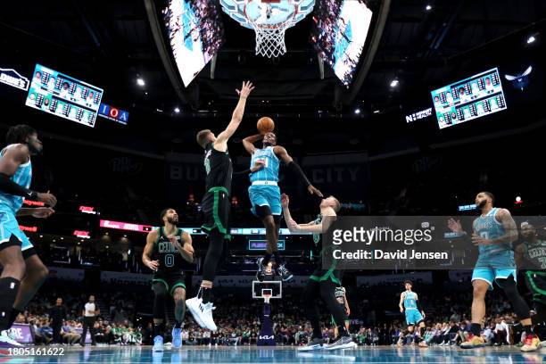Brandon Miller of the Charlotte Hornets dunks the ball during the first half of an NBA game against the Boston Celtics at Spectrum Center on November...