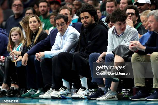 Music Star and minority owner of the Charlotte Hornets, J. Cole, attends an NBA game between the Charlotte Hornets and the Boston Celtics at Spectrum...