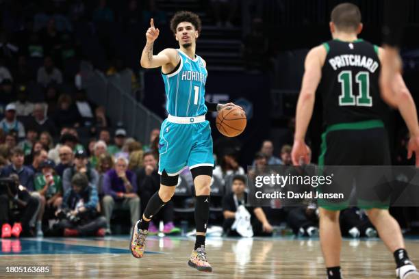 LaMelo Ball of the Charlotte Hornets brings the ball down the court during an NBA game against the Boston Celtics at Spectrum Center on November 20,...