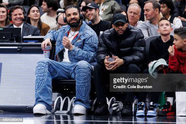 Rapper Drake sits court side during the second half of the NBA In-Season Tournament game between the Toronto Raptors and the Boston Celtics at...