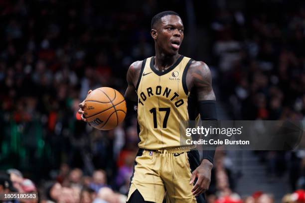 Dennis Schroder of the Toronto Raptors dribbles the ball up the court against the Boston Celtics during the second half of their NBA In-Season...