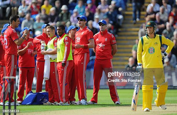 Australia captain Michael Clarke walks off as England celebrate after taking his wicket after a third umpire decision during the 4th NatWest Series...