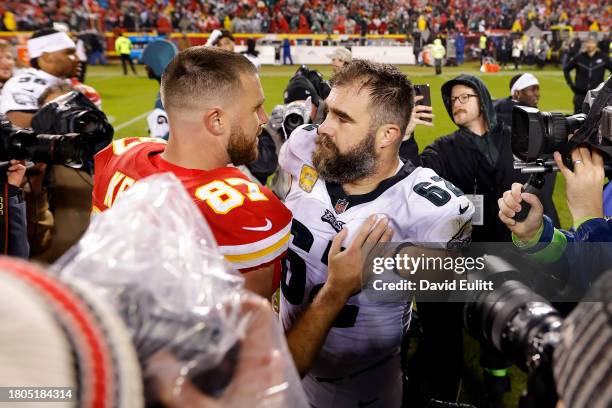 Jason Kelce of the Philadelphia Eagles talks to brother Travis Kelce of the Kansas City Chiefs after their game at GEHA Field at Arrowhead Stadium on...