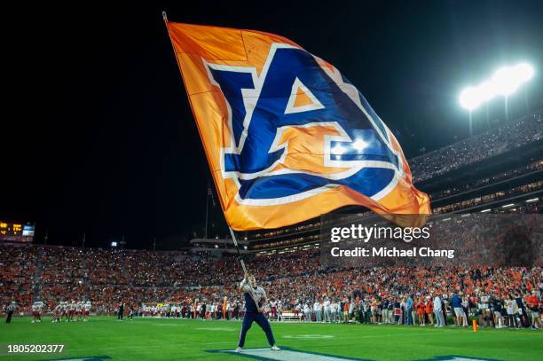 Cheerleader with the Auburn Tigers waves their flag during their game against the New Mexico State Aggies at Jordan-Hare Stadium on November 18, 2023...