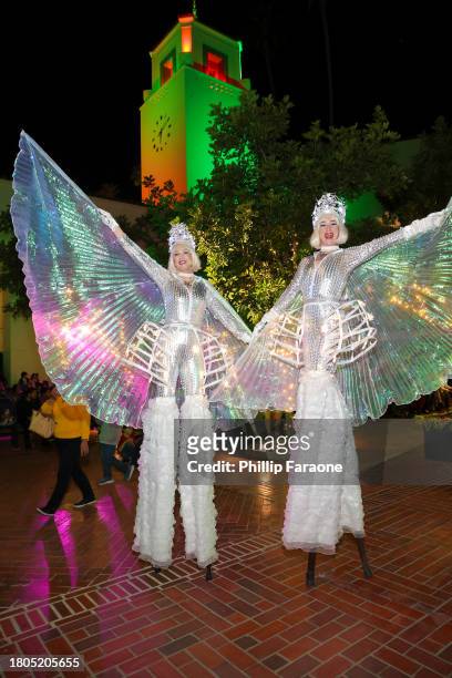 Snowflake stilt walkers are seen during the Los Angeles Union Station Tree Lighting Ceremony at Union Station on November 20, 2023 in Los Angeles,...