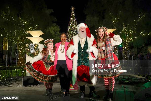 Stephanie Wiggins, Chief Executive Officer at Los Angeles Metro with Santa and his Elves onstage during the Los Angeles Union Station Tree Lighting...