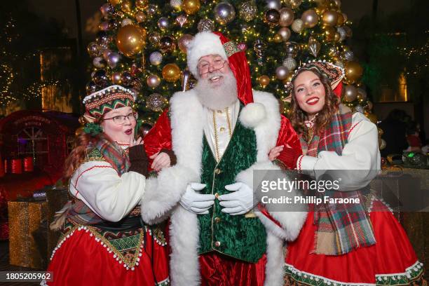 Santa and his Elves attend the Los Angeles Union Station Tree Lighting Ceremony at Union Station on November 20, 2023 in Los Angeles, California.