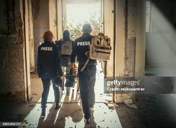 war reporters return home after finishing filming - journalists stock pictures, royalty-free photos & images