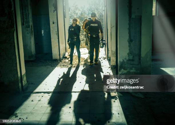 war reporters return home after finishing filming - highly trafficked stock pictures, royalty-free photos & images