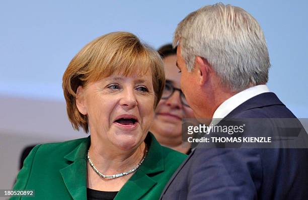 German Chancellor Angela Merkel talks with talks with Thomas Strobl , regional party chairman of their CDU party in the southern German state of...