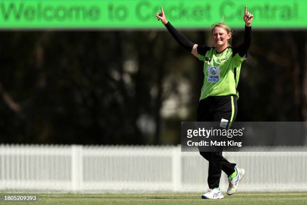 Sammy-Jo Johnson of the Thunder celebrates taking the wicket of Jemma Barsby of the Strikers during the WBBL match between Sydney Thunder and...