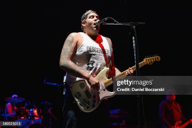 Rome Ramirez of Sublime with Rome performs on stage on Day 1 of Riot Fest and Carnival 2013 at Humboldt Park on September 13, 2013 in Chicago,...