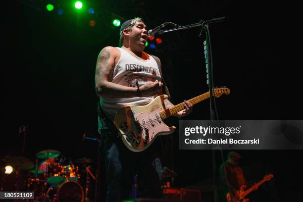 Rome Ramirez of Sublime with Rome performs on stage on Day 1 of Riot Fest and Carnival 2013 at Humboldt Park on September 13, 2013 in Chicago,...