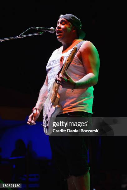 Rome Ramirez of Sublime with Rome performs on stage on Day 1 of Riot Fest and Carnival 2013 at Humboldt Park on September 13, 2013 in Chicago,...