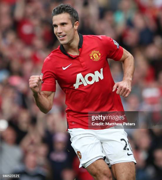 Robin van Persie of Manchester United celebrates scoring their first goal during the Barclays Premier League match between Manchester United and...