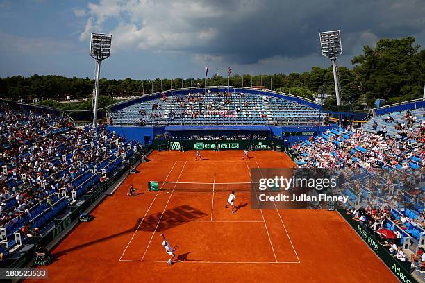 Andy Murray and Colin Fleming of Great Britain in action against Ivan Dodig and Mate Pavic of Croatia in the doubles during day two of the Davis Cup...