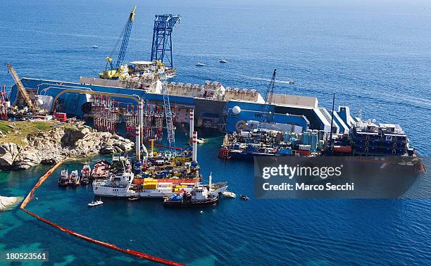 The wreckage of the Costa Concordia is seen from above the harbour on September 14, 2013 in Isola del Giglio, Italy. The Costa Concordia is...