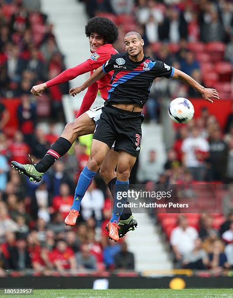 Marouane Fellaini of Manchester United in action with Adlene Guedioura of Crystal Palace during the Barclays Premier League match between Manchester...