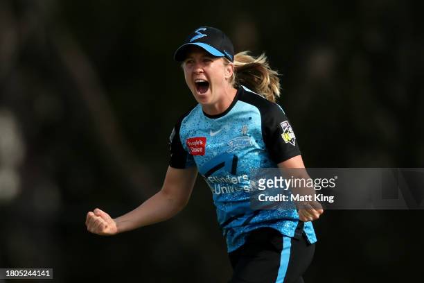 Jemma Barsby of the Strikers celebrates taking the wicket of Chamara Athapaththu of the Thunder during the WBBL match between Sydney Thunder and...