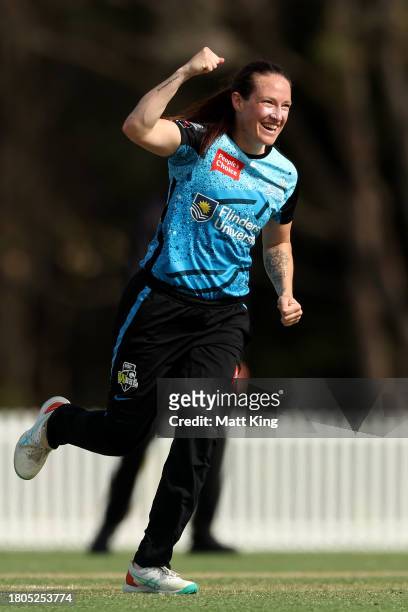 Meghan Schutt of the Strikers celebrates taking the wicket of Phoebe Litchfield of the Thunder during the WBBL match between Sydney Thunder and...