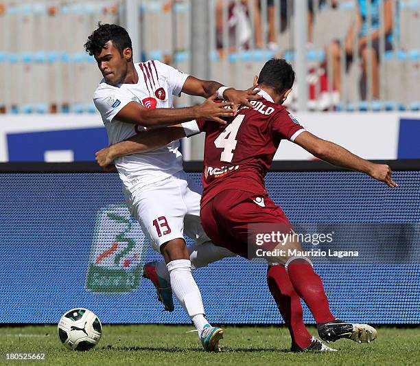 Adriano Louzada of Reggina competes for the ball with Luca Pagliarulo of Trapani during the Serie B match between Trapani Calcio and Reggina Calcio...