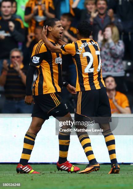 Curtis Davies of Hull City celebrates with Ahmed Elmohamady as he scores their first goal during the Barclays Premier League match between Hull City...