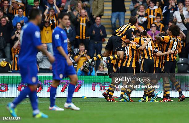Depair for Cardiff City as Curtis Davies of Hull City celebrates with team mates as he scores their first goal during the Barclays Premier League...