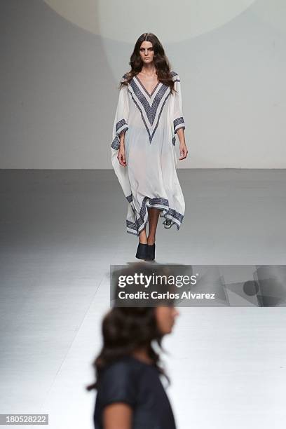 Models showcase designs by Teresa Helbig on the runway at Teresa Helbig show during Mercedes Benz Fashion Week Madrid Spring/Summer 2014 on September...